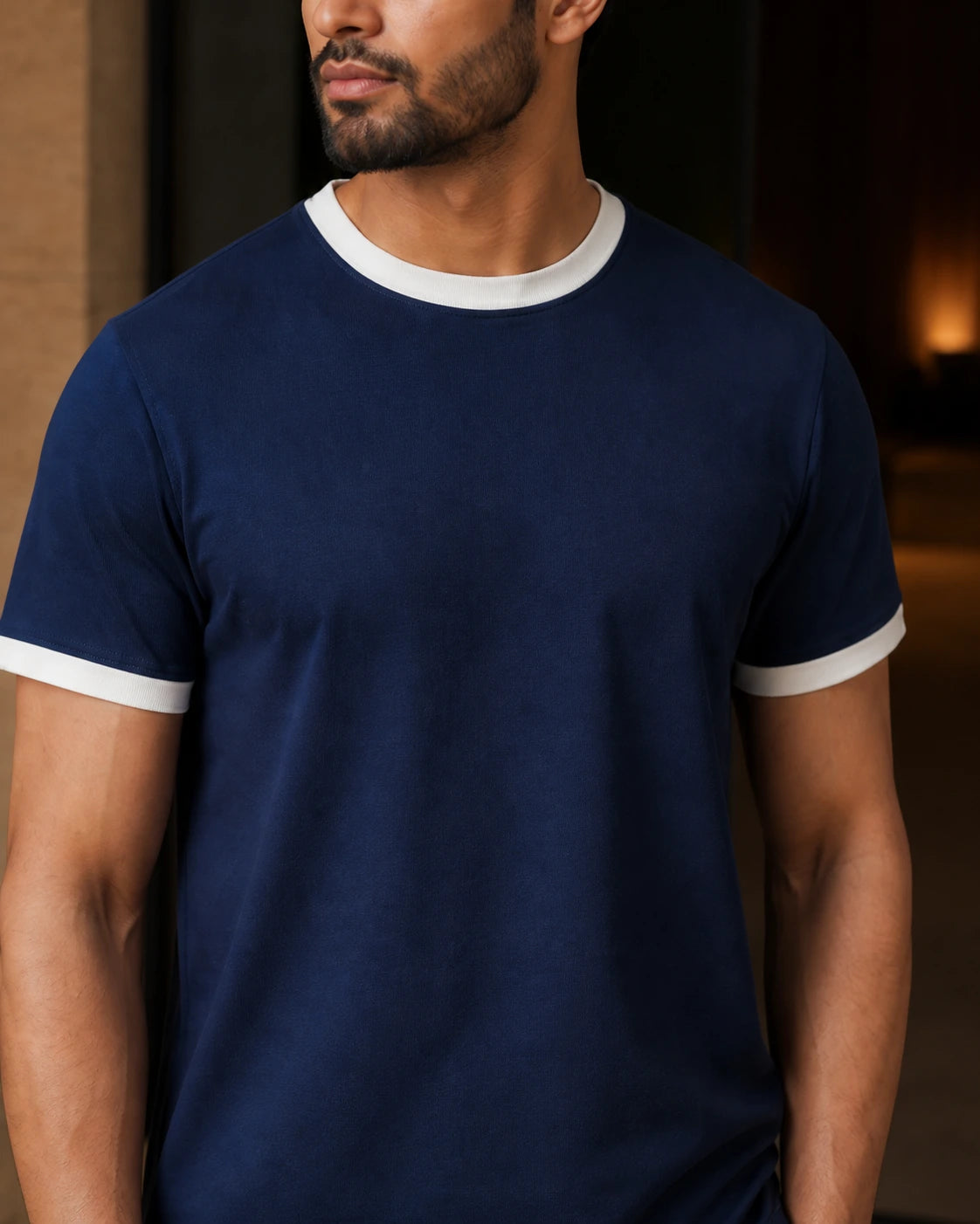 Close-up of the DARENZ First Line Ringer Tee in Midnight / Chalk, showing the chalk ribbed neckline, matching sleeve edges and midnight jersey surface