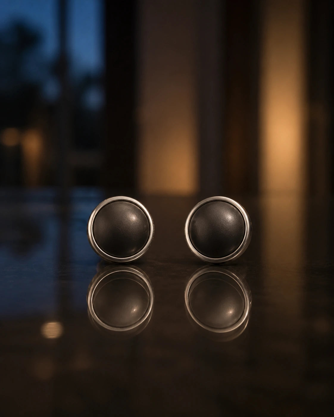 Matched DARENZ Full Stop Stud Pair still life on charcoal stone with precise polished rims