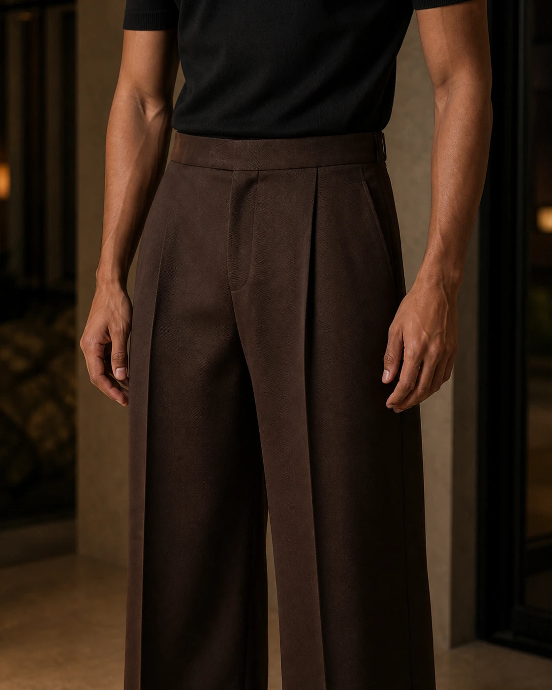 Close-up of the DARENZ Long Form Loose Tailored Trousers in Umber, showing the umber twill surface, pressed crease and clean concealed closure