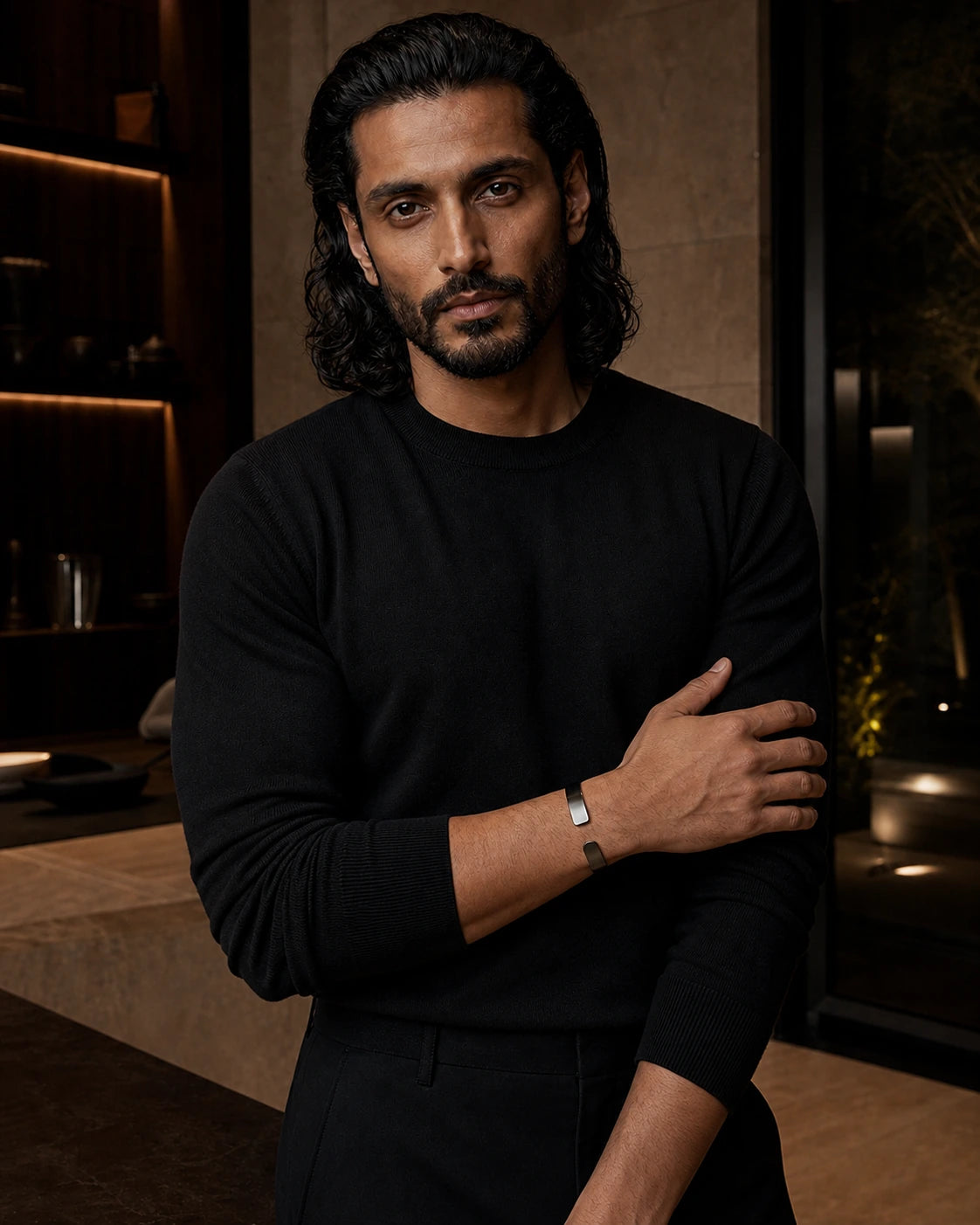 Alternate on-body view of the DARENZ Parenthesis Cuff, showing its blackened steel finish against evening tailoring