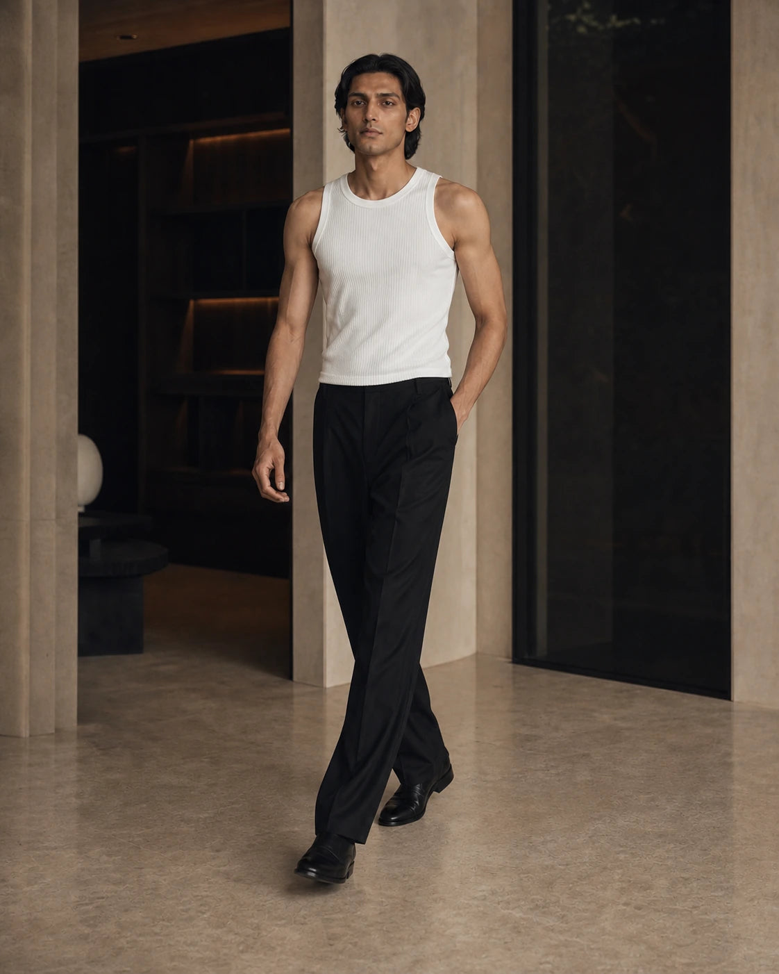 DARENZ Underline Ribbed Vest in Chalk shown in motion beside dark timber, with the garment drape clearly visible