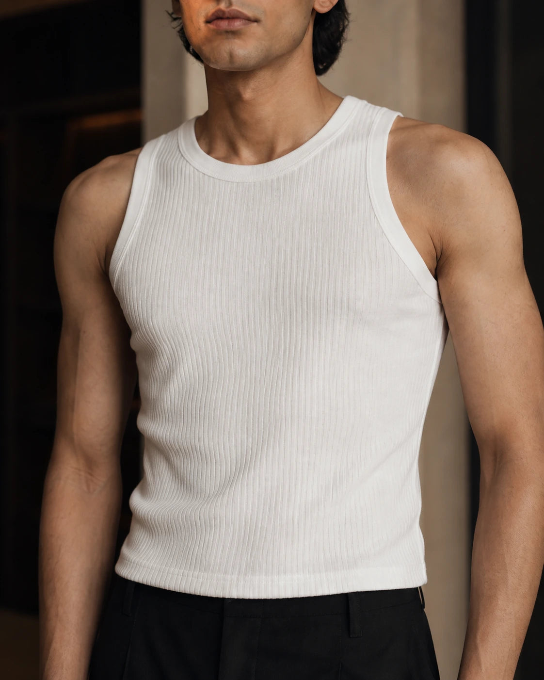 Close-up of the DARENZ Underline Ribbed Vest in Chalk, showing the chalk ribbed cotton surface, neckline binding and clean arm opening